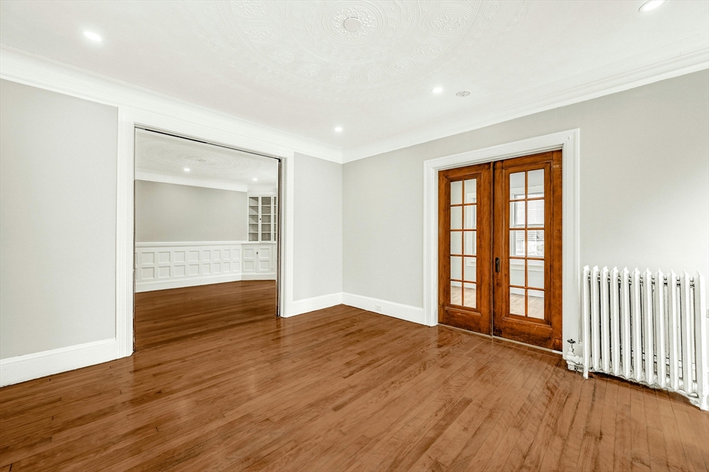 34 William Street Worcester, MA 01609 - Photo 8 of 41 an empty room with wooden floor and windows