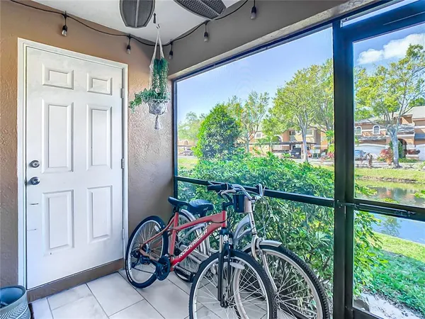 a view of a door and deck in the balcony