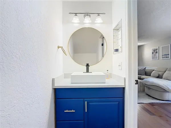 a en suite bathroom with a sink and a mirror