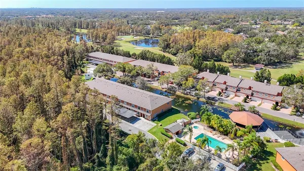 an aerial view of residential houses with outdoor space
