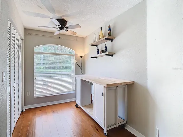 a view of livingroom with hardwood floor and ceiling fan