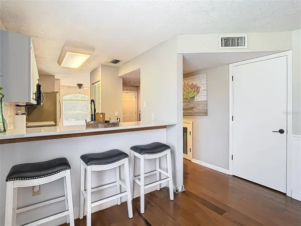 a kitchen with a table and chairs in it