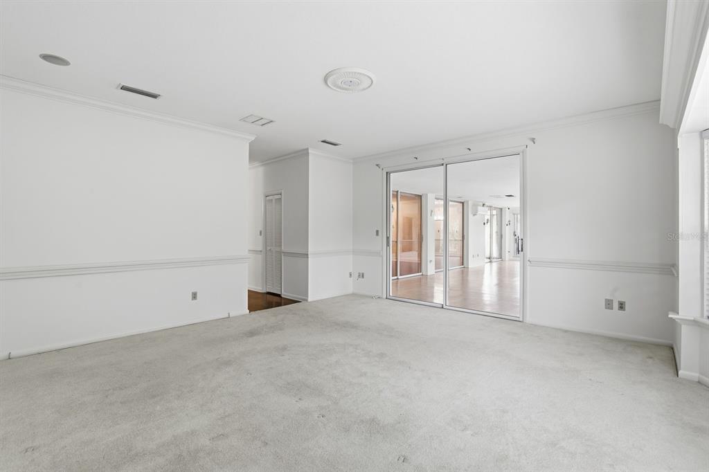 6307 Southwest 35th Way Gainesville, FL 32608 - Photo 18 of 32 wooden floor in an empty room