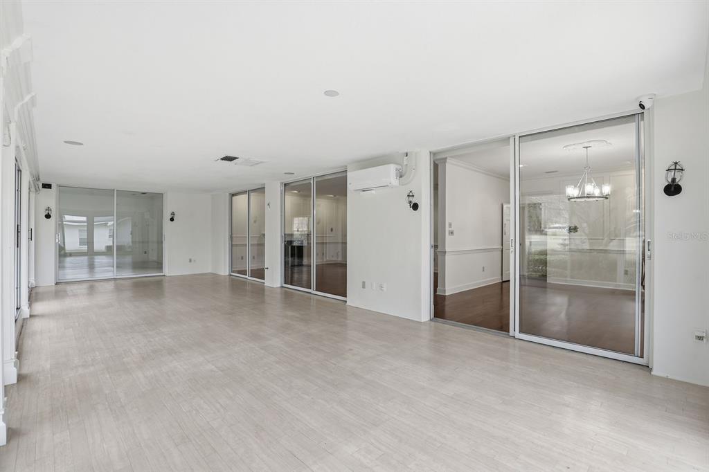 6307 Southwest 35th Way Gainesville, FL 32608 - Photo 22 of 32 a view of empty room with large windows