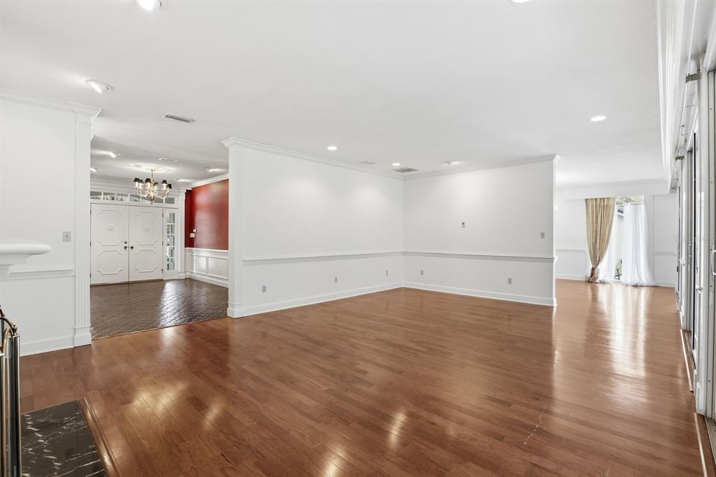 6307 Southwest 35th Way Gainesville, FL 32608 - Photo 4 of 32 a view of an empty room with wooden floor