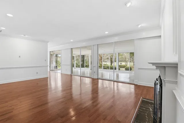 a view of an entryway with wooden floor