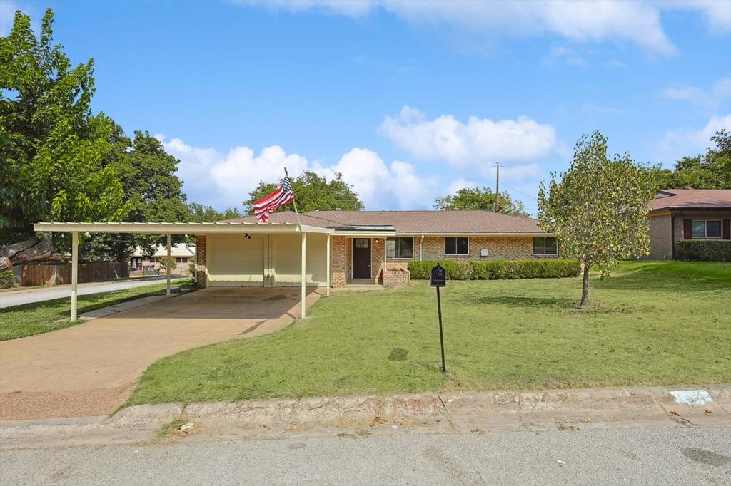 front view of a house with a yard