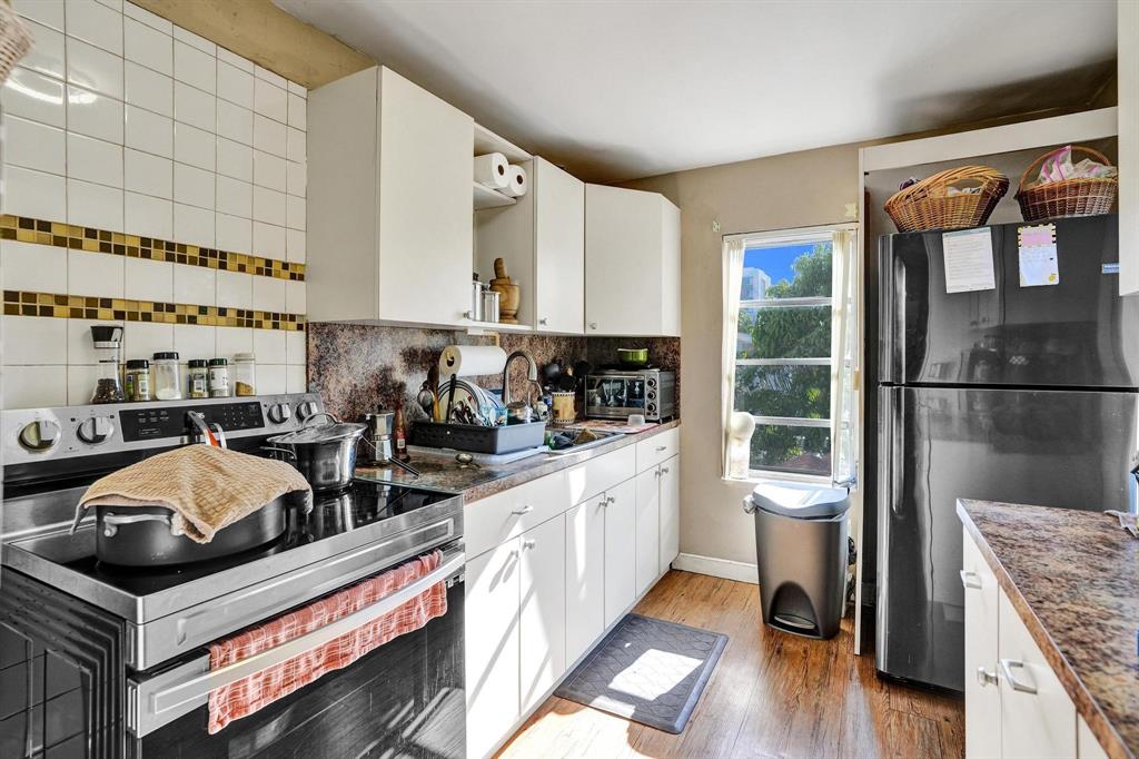 Allapattah Miami, FL 33142 - Photo 13 of 58 a kitchen with stainless steel appliances granite countertop a stove a sink and a refrigerator