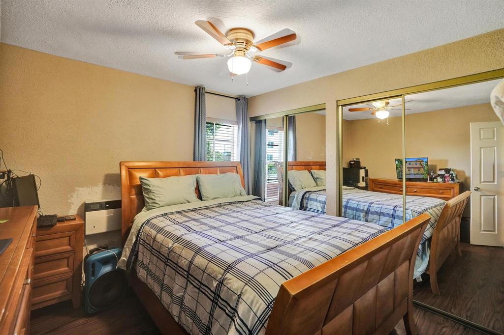 Allapattah Miami, FL 33142 - Photo 18 of 58 a bedroom with bed and wooden floor