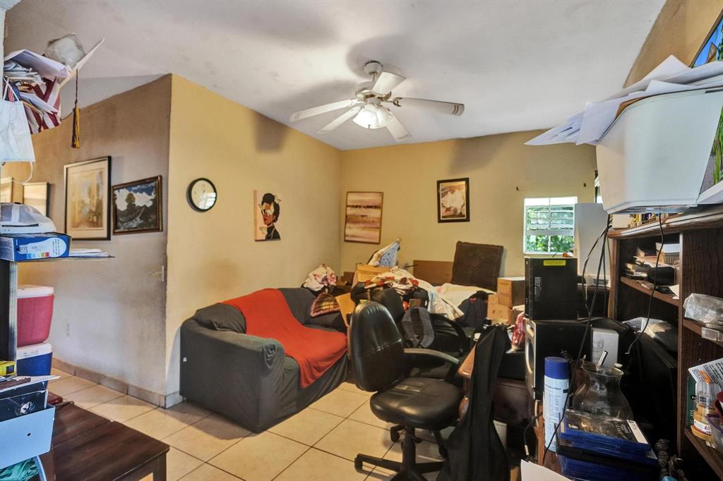 Allapattah Miami, FL 33142 - Photo 26 of 58 a living room with lots of furniture and gym equipment