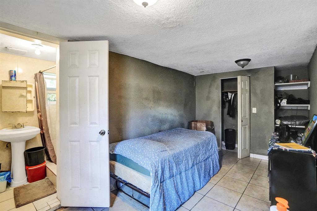 Allapattah Miami, FL 33142 - Photo 51 of 58 a bedroom with a bed and a walk in closet