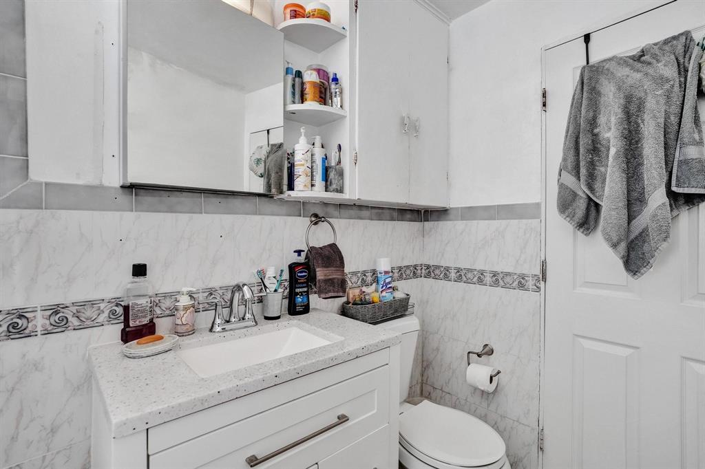 Allapattah Miami, FL 33142 - Photo 9 of 58 a bathroom with a sink and a mirror