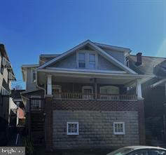 512 Sheridan Place Cumberland, MD 21502 - Photo 1 of 16 a front view of a house with garage