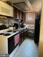 512 Sheridan Place Cumberland, MD 21502 - Photo 12 of 16 a kitchen with a stove sink and cabinets