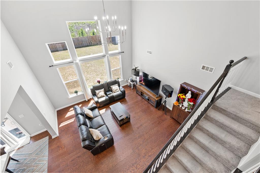 4607 Underwood Walk Powder Springs, GA 30127 - Photo 15 of 31 a room with furniture and a chandelier