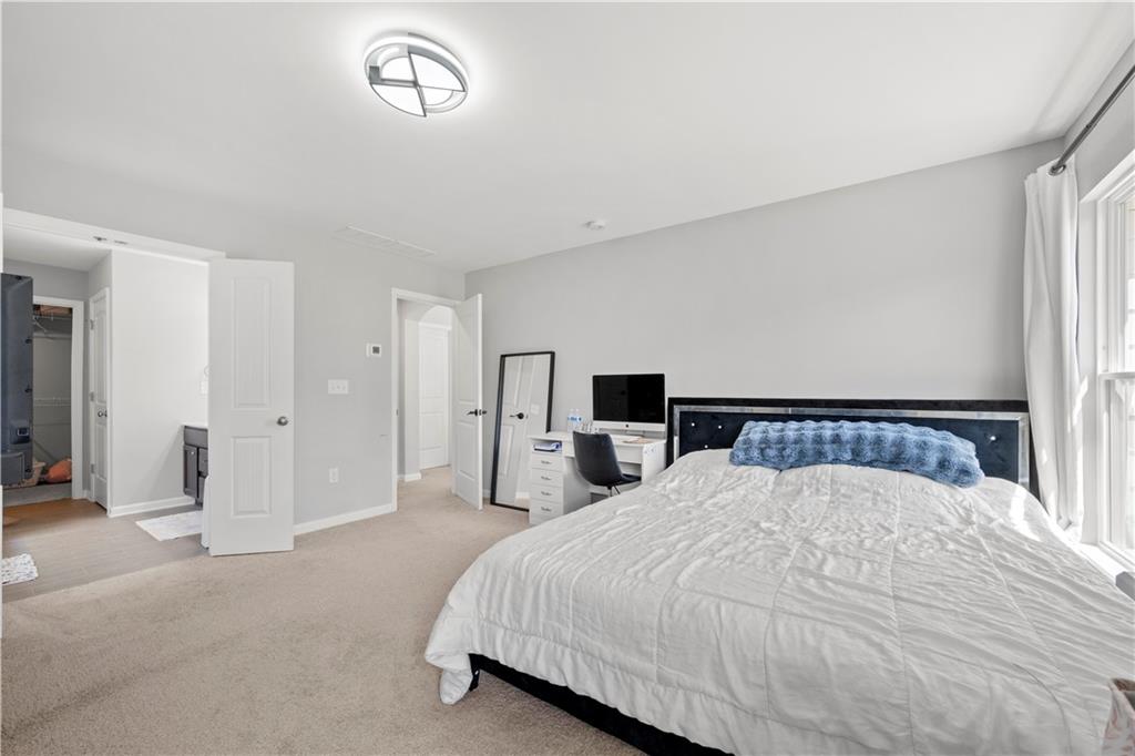 4607 Underwood Walk Powder Springs, GA 30127 - Photo 17 of 31 a large white bed in a white room