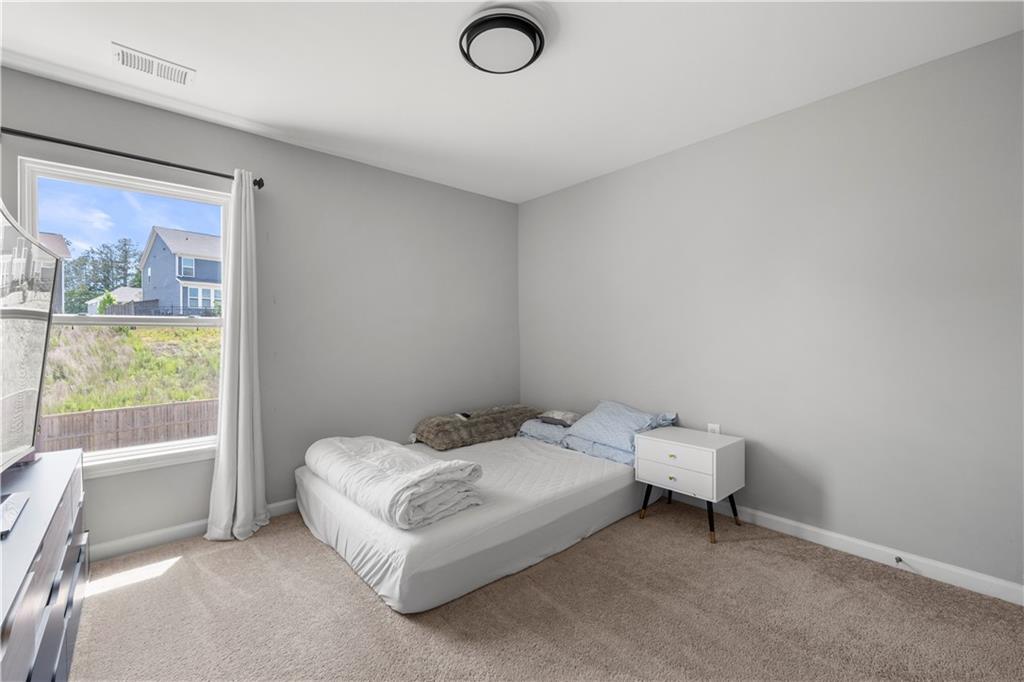 4607 Underwood Walk Powder Springs, GA 30127 - Photo 20 of 31 a bed room with a bed and a window