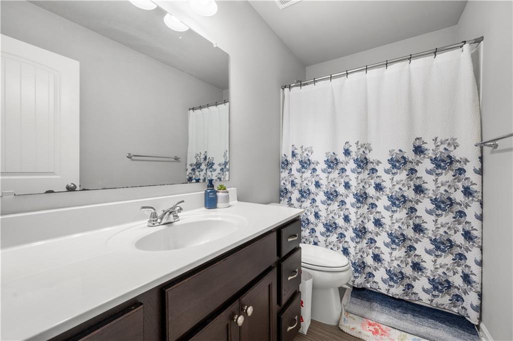 4607 Underwood Walk Powder Springs, GA 30127 - Photo 22 of 31 a bathroom with a sink toilet and shower