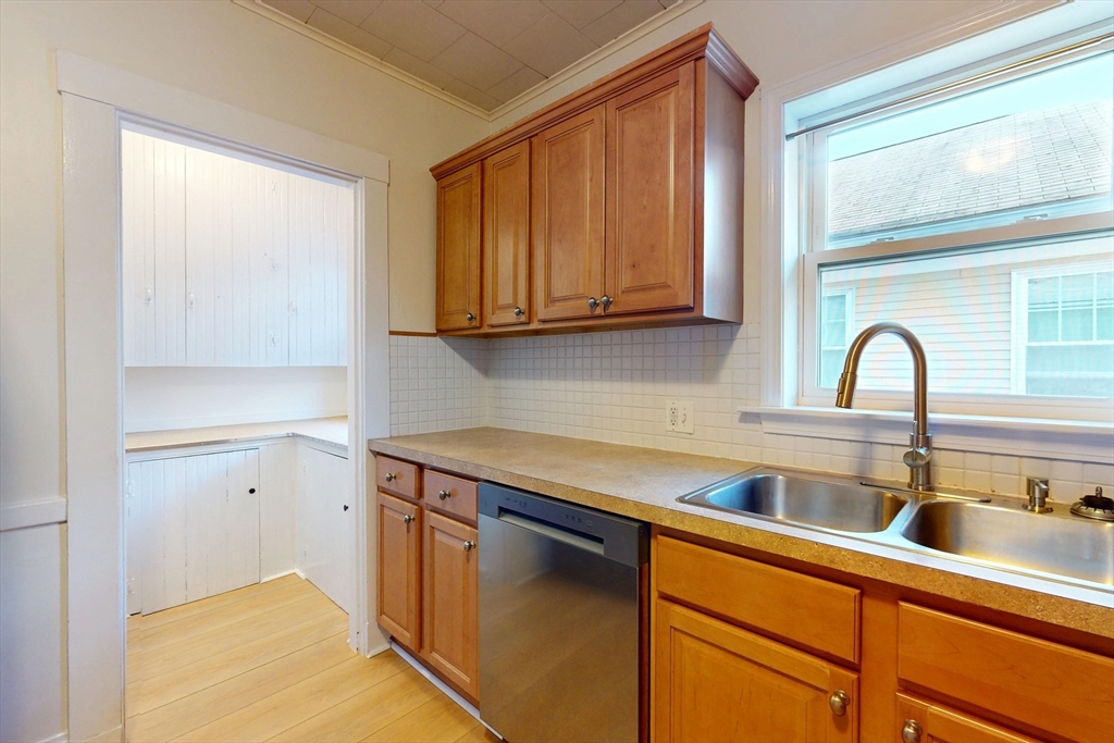 12 Park Street, Unit 2 Waltham, MA 02453 - Photo 11 of 20 a kitchen with a sink and cabinets