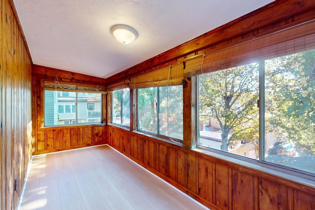 12 Park Street, Unit 2 Waltham, MA 02453 - Photo 19 of 20 a view of an empty room with wooden floor and a window