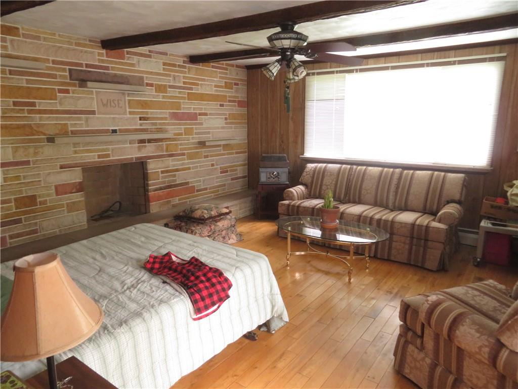 629 Freeport Road Butler, PA 16002 - Photo 7 of 26 a bedroom with a bed couch and a dresser