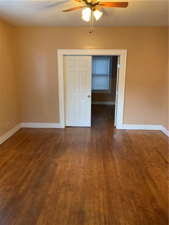 2714 Whitis Avenue, Unit ABC Austin, TX 78705 - Photo 8 of 24 Spare room featuring ceiling fan and dark wood finished floors