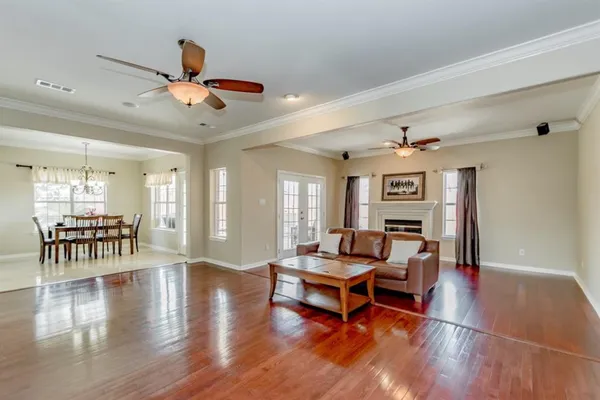 a living room with furniture and a table