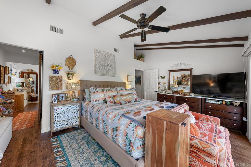 1356 South Grade Road Alpine, CA 91901 - Photo 16 of 68 a bedroom with a bed a flat screen tv and a couch