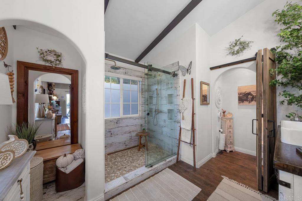 1356 South Grade Road Alpine, CA 91901 - Photo 19 of 68 a bathroom with a glass shower door and a sink