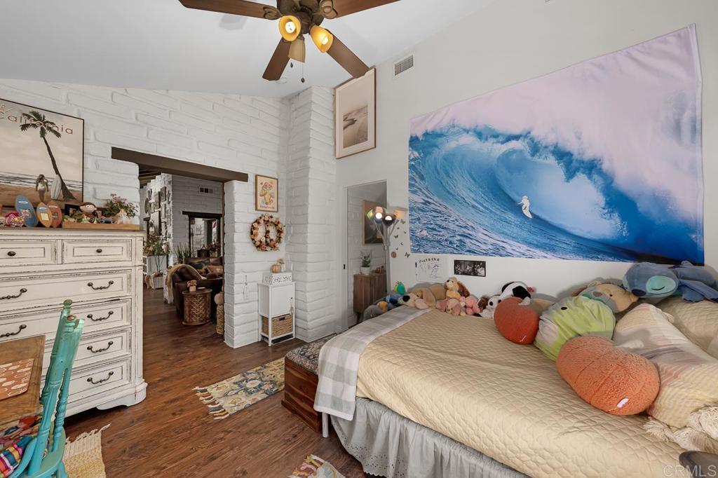 1356 South Grade Road Alpine, CA 91901 - Photo 24 of 68 a bedroom with a bed and wooden floor