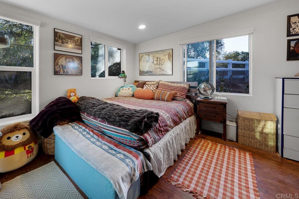 1356 South Grade Road Alpine, CA 91901 - Photo 25 of 68 a bedroom with a bed and wooden floor