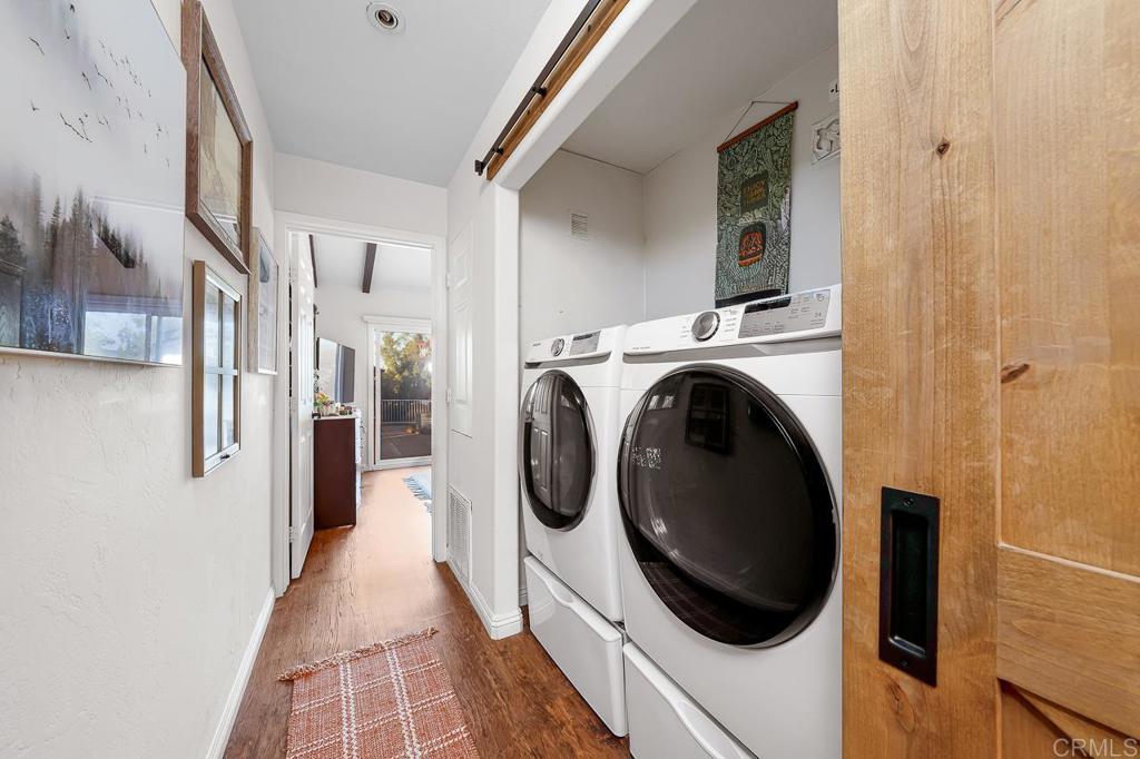 1356 South Grade Road Alpine, CA 91901 - Photo 31 of 68 a view of a hallway with washer and dryer