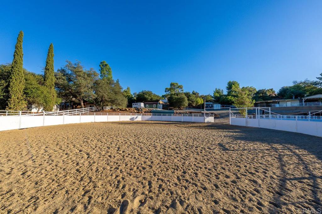 1356 South Grade Road Alpine, CA 91901 - Photo 45 of 68 a view of swimming pool with outdoor seating and trees in the background