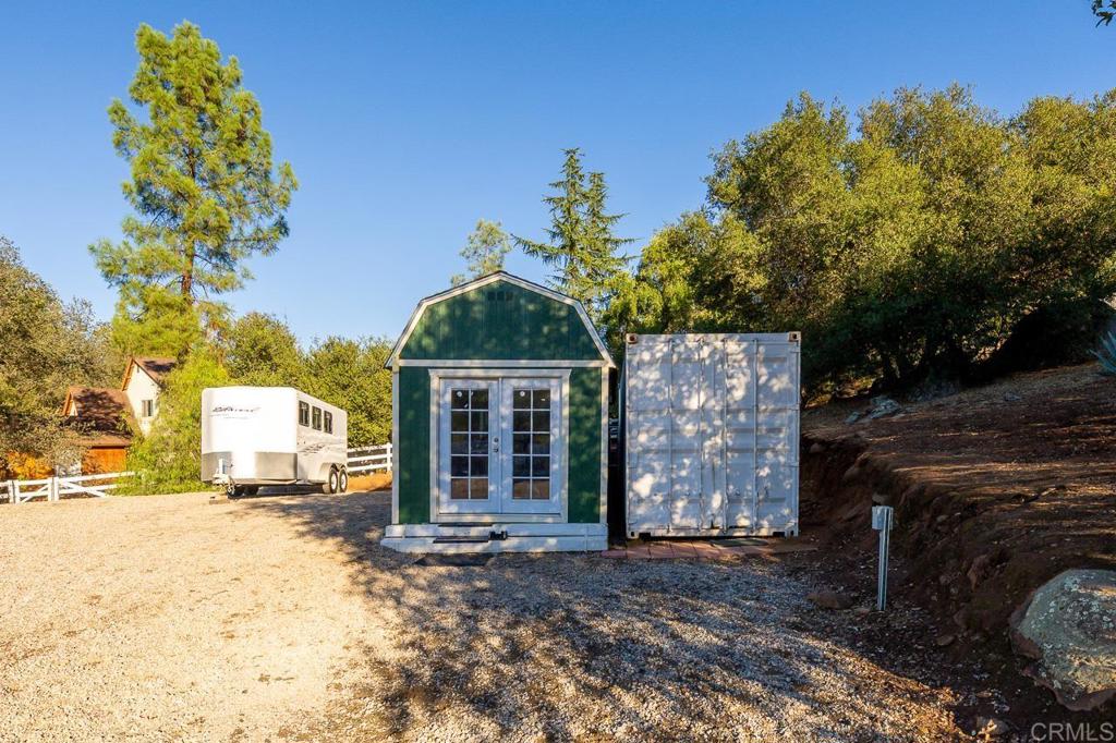 1356 South Grade Road Alpine, CA 91901 - Photo 58 of 68 a front view of a house with a yard and garage