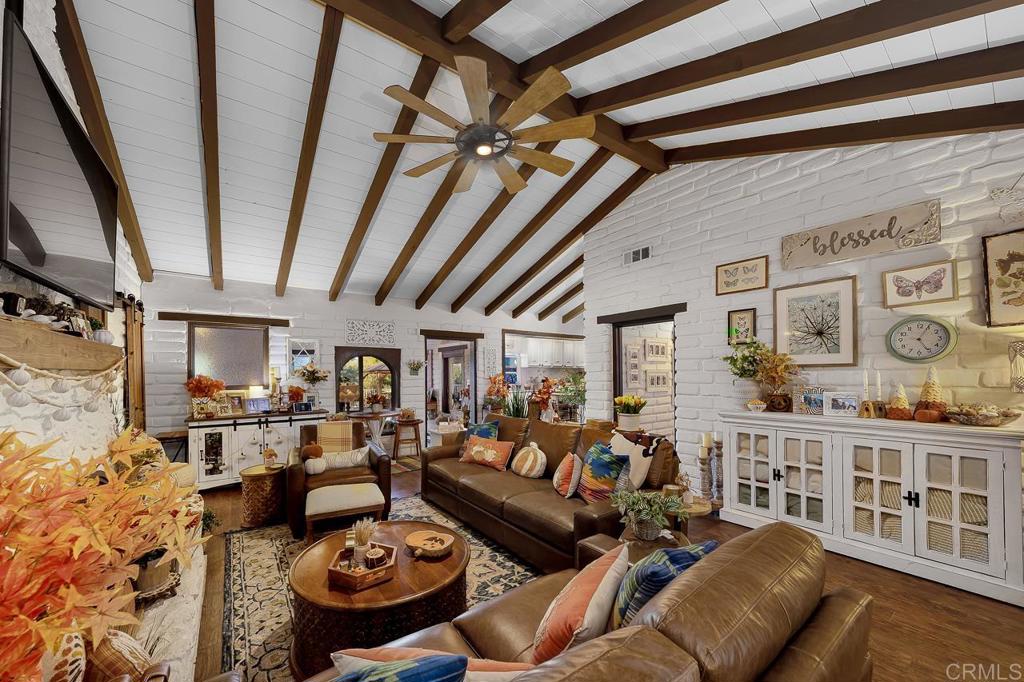 1356 South Grade Road Alpine, CA 91901 - Photo 6 of 68 a living room with lots of furniture and kitchen view