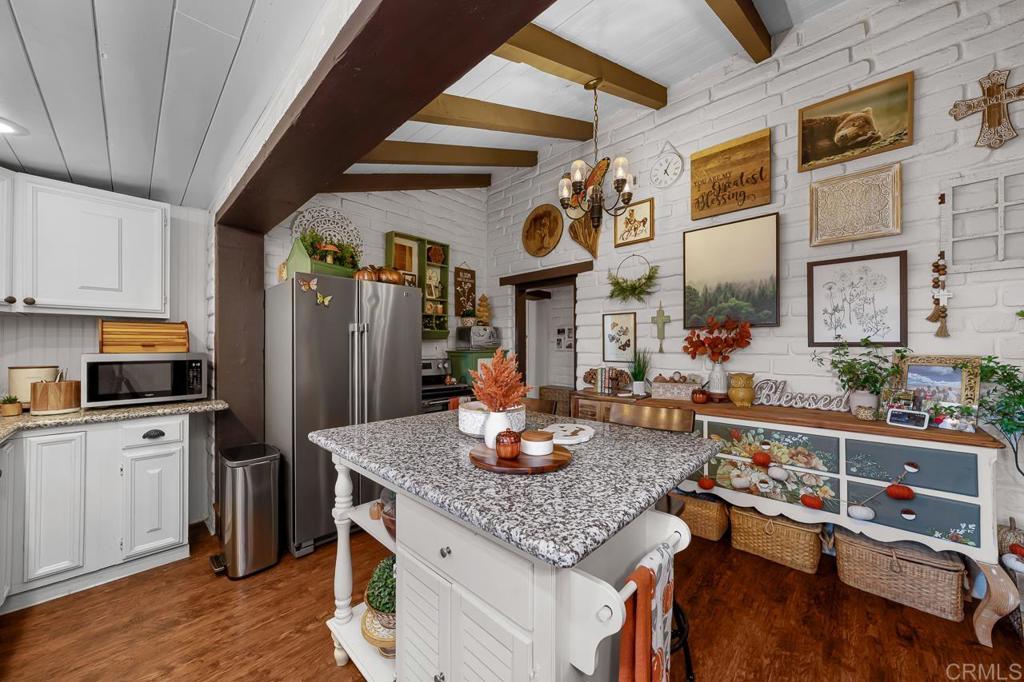1356 South Grade Road Alpine, CA 91901 - Photo 8 of 68 a kitchen with stainless steel appliances granite countertop a sink stove and refrigerator