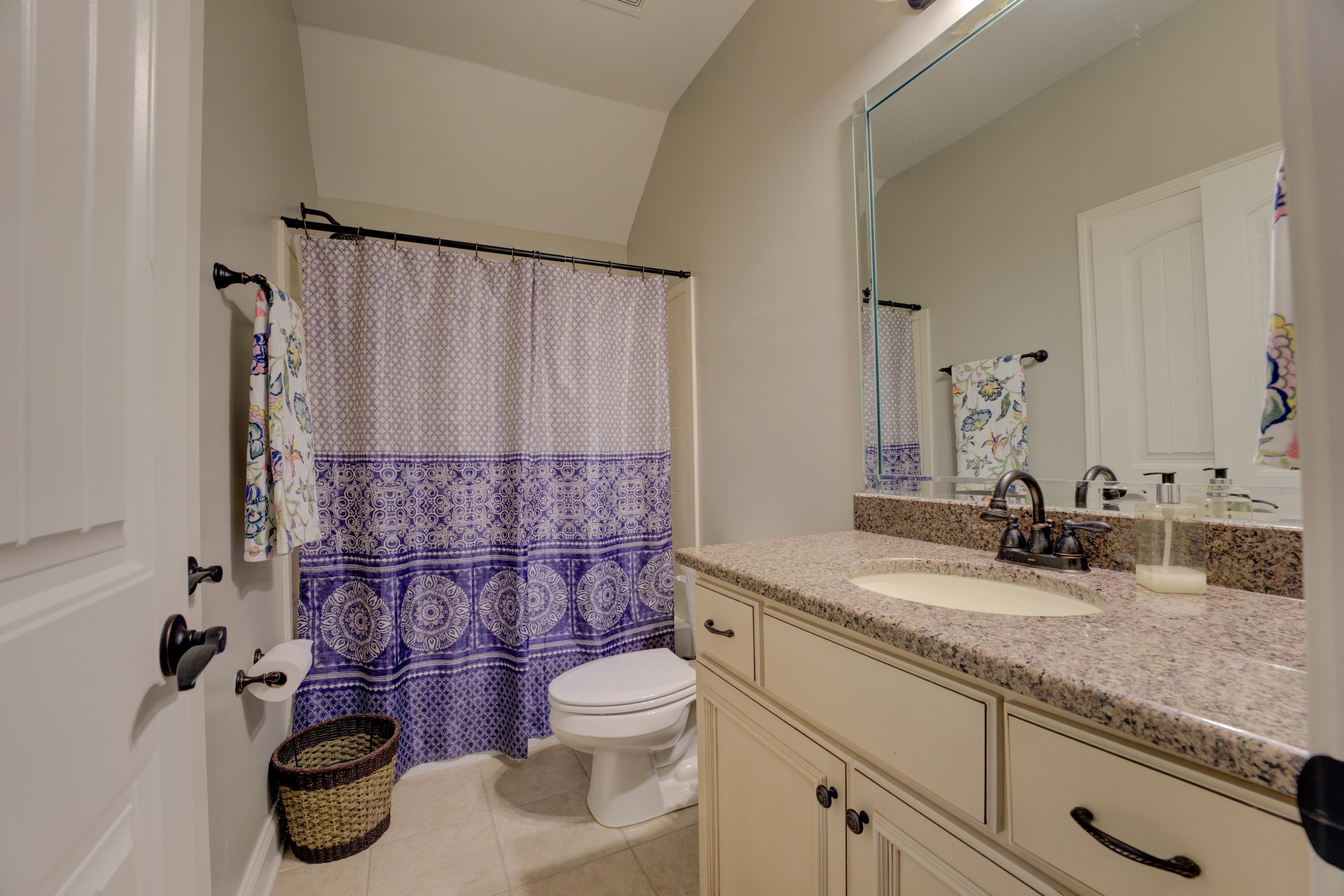 389 West Tarren Mill Circle Collierville, TN 38017 - Photo 17 of 22 a bathroom with a granite countertop toilet sink and mirror