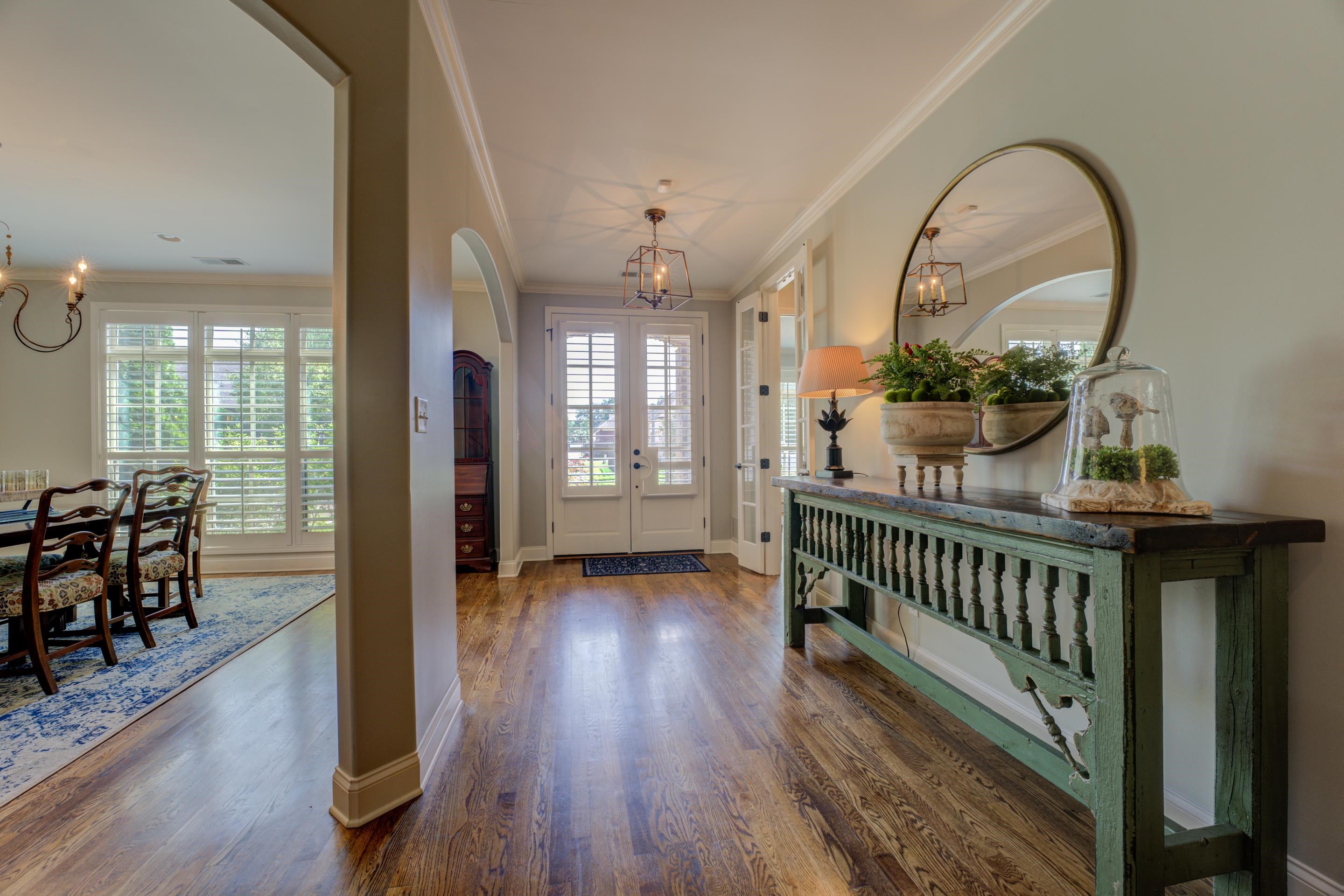 389 West Tarren Mill Circle Collierville, TN 38017 - Photo 3 of 22 an empty room with wooden floor and windows