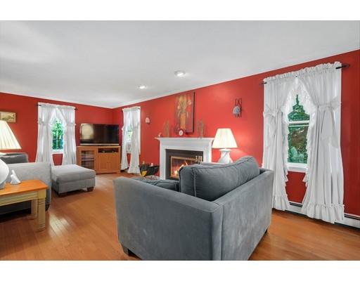 65 Grover Street Beverly, MA 01915 - Photo 13 of 33 a living room with furniture and a fireplace