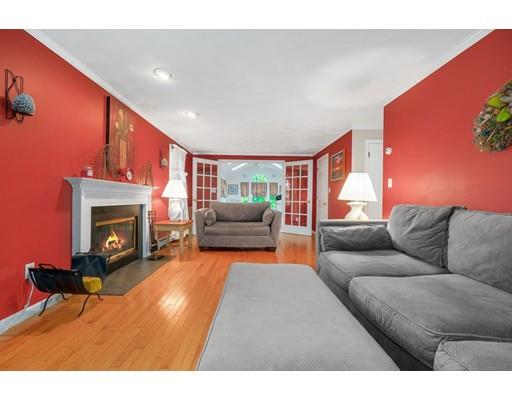 65 Grover Street Beverly, MA 01915 - Photo 15 of 33 a living room with furniture and a fireplace