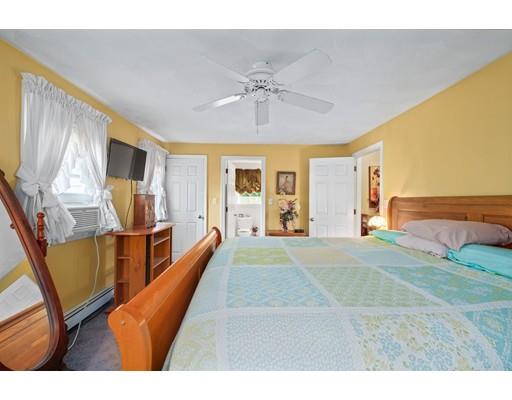 65 Grover Street Beverly, MA 01915 - Photo 21 of 33 a view of living room kitchen with furniture and flat screen tv