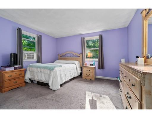 65 Grover Street Beverly, MA 01915 - Photo 23 of 33 a bedroom with a bed and a dresser
