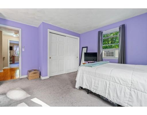 65 Grover Street Beverly, MA 01915 - Photo 24 of 33 a bedroom with a bed and a window