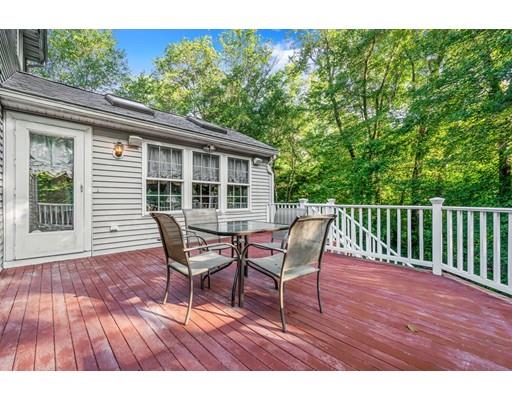 65 Grover Street Beverly, MA 01915 - Photo 30 of 33 a view of a chair and table on the wooden deck