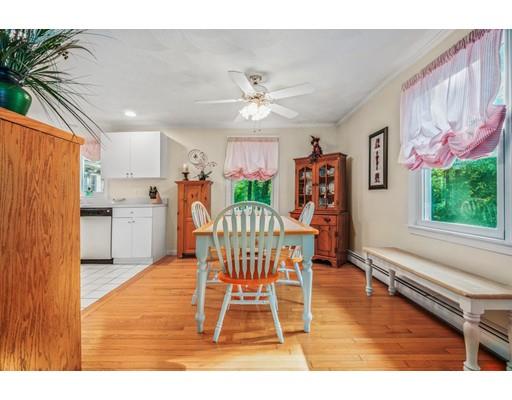 65 Grover Street Beverly, MA 01915 - Photo 8 of 33 a view of a dining room with furniture window and wooden floor