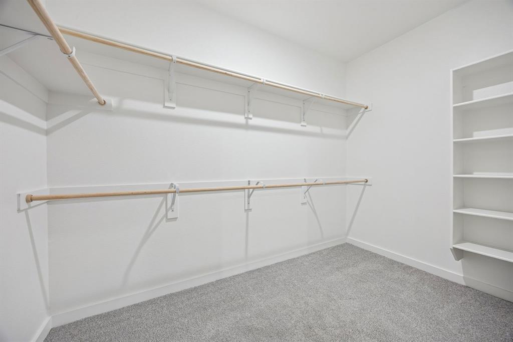 316 Millwood Road Lavon, TX 75166 - Photo 23 of 37 Primary Closet in the Oak II home plan by Trophy Signature Homes – REPRESENTATIVE PHOTO