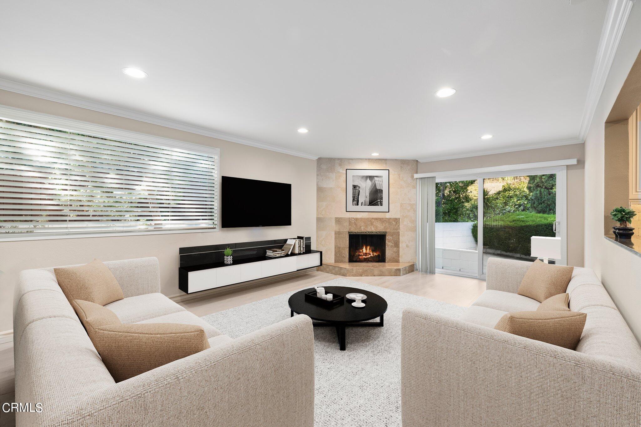9356 Skyview Terrace Tujunga, CA 91042 - Photo 15 of 39 a living room with furniture and a flat screen tv