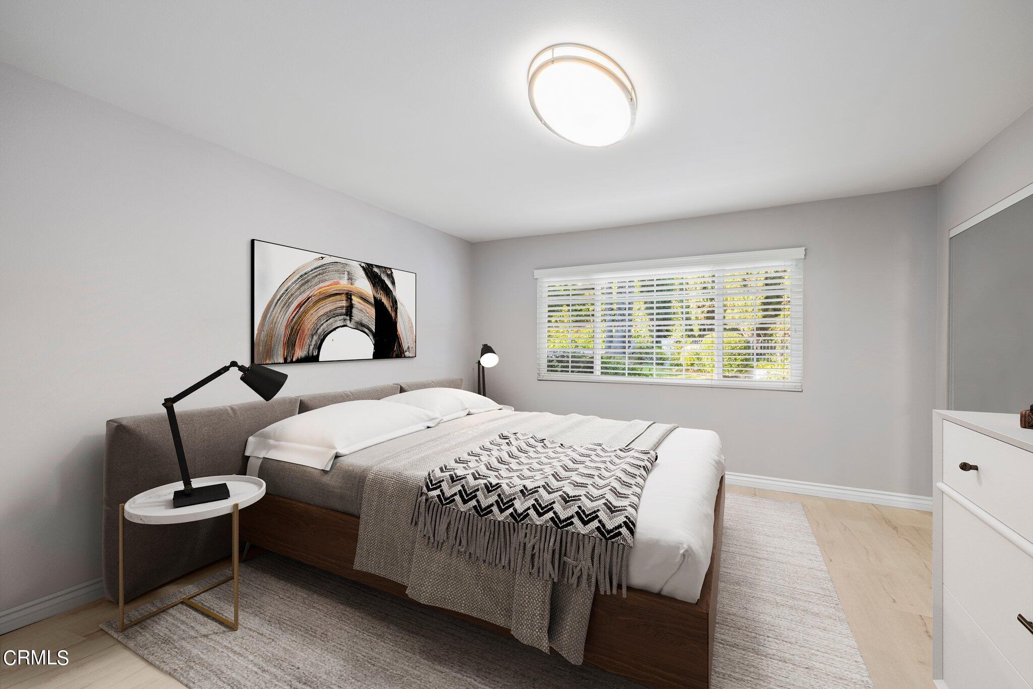 9356 Skyview Terrace Tujunga, CA 91042 - Photo 20 of 39 a bedroom with a bed and a window