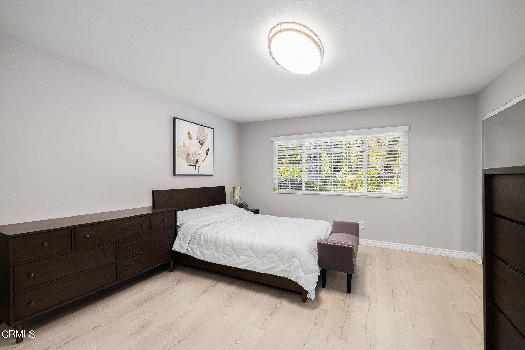 9356 Skyview Terrace Tujunga, CA 91042 - Photo 22 of 39 a bedroom with a bed and a window