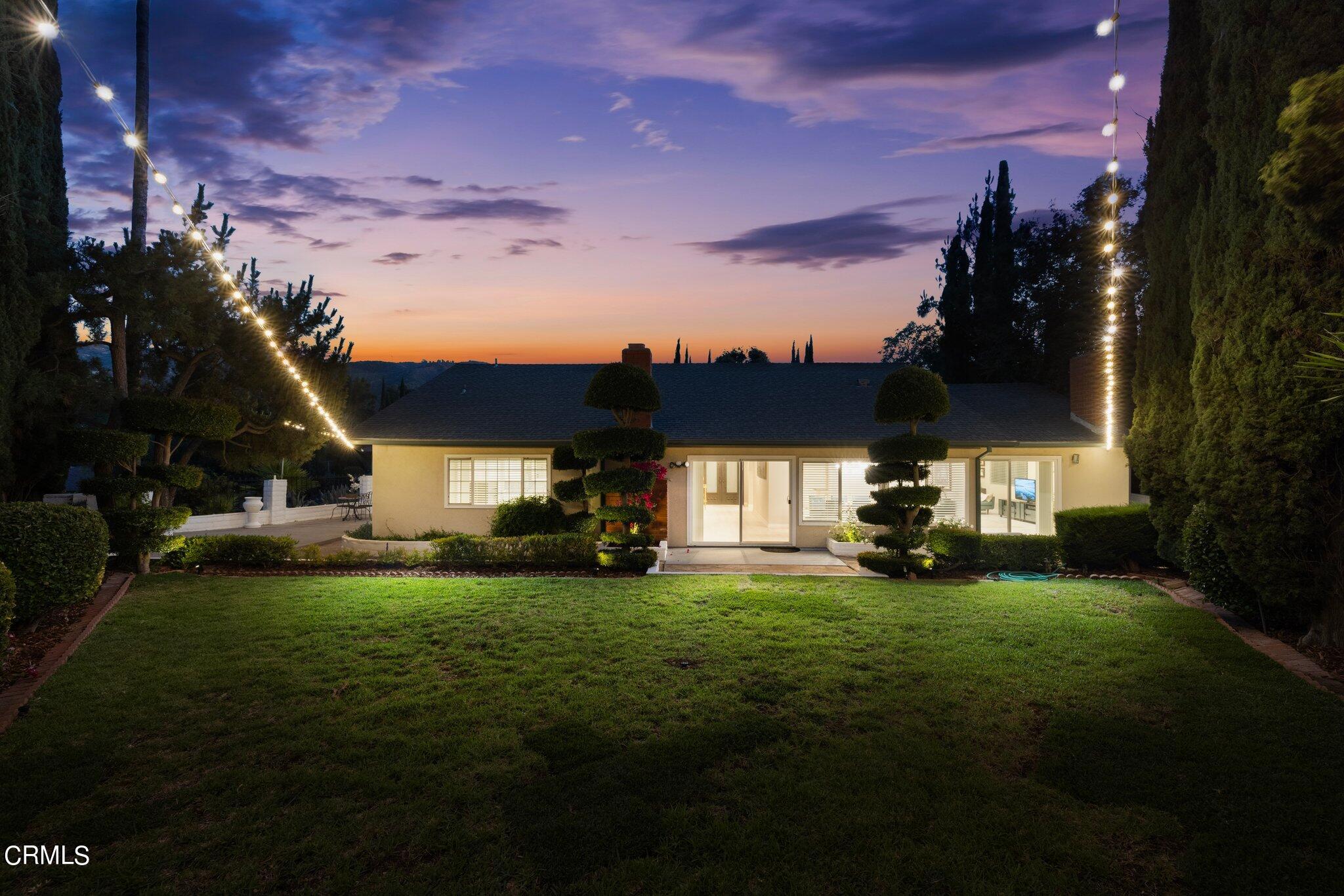 9356 Skyview Terrace Tujunga, CA 91042 - Photo 30 of 39 a view of a house with a big yard and a large tree